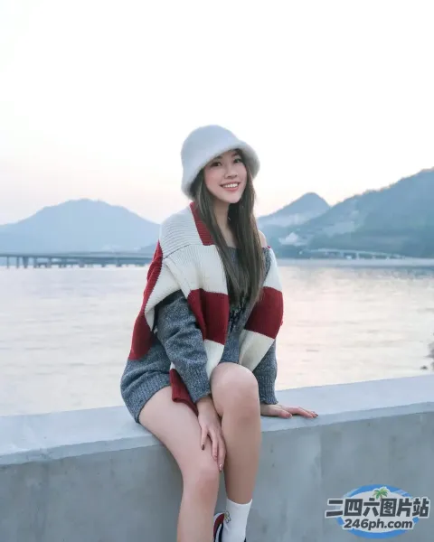 坐在水边墙上的阿拉夫德女人